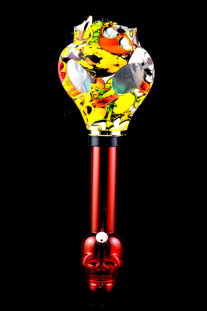 Red skull-base acrylic bong paired with yellow cartoon decal gas mask with large eye windows.