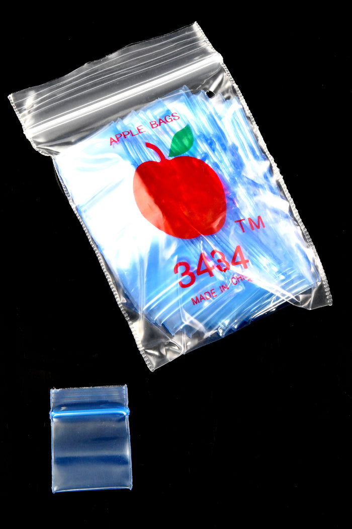 Solid blue Apple Bags ¾-inch mini zipper baggie bundle with one loose bag below to display compact size and airtight seal