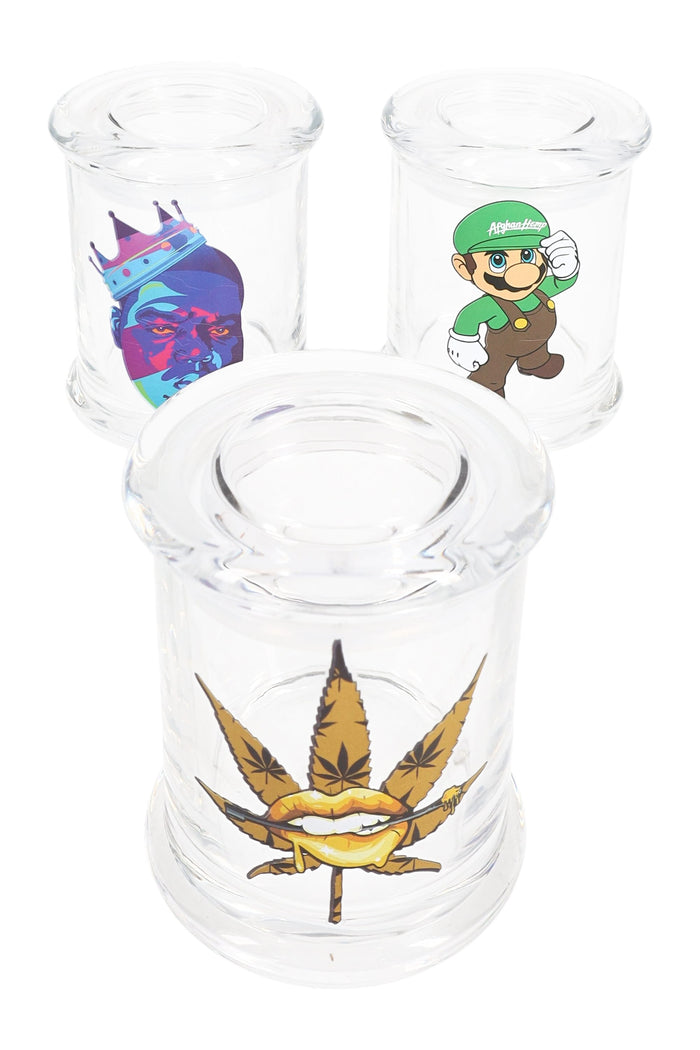 Three clear glass apothecary jars with random decals—weed leaf lips, crowned gorilla, Luigi parody—displayed on white background