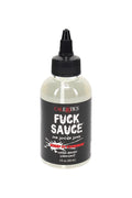 “Fuck Sauce” water-based personal lubricant in a 4-oz clear bottle with precision nozzle and black label, shown in a close-up retail product photo.