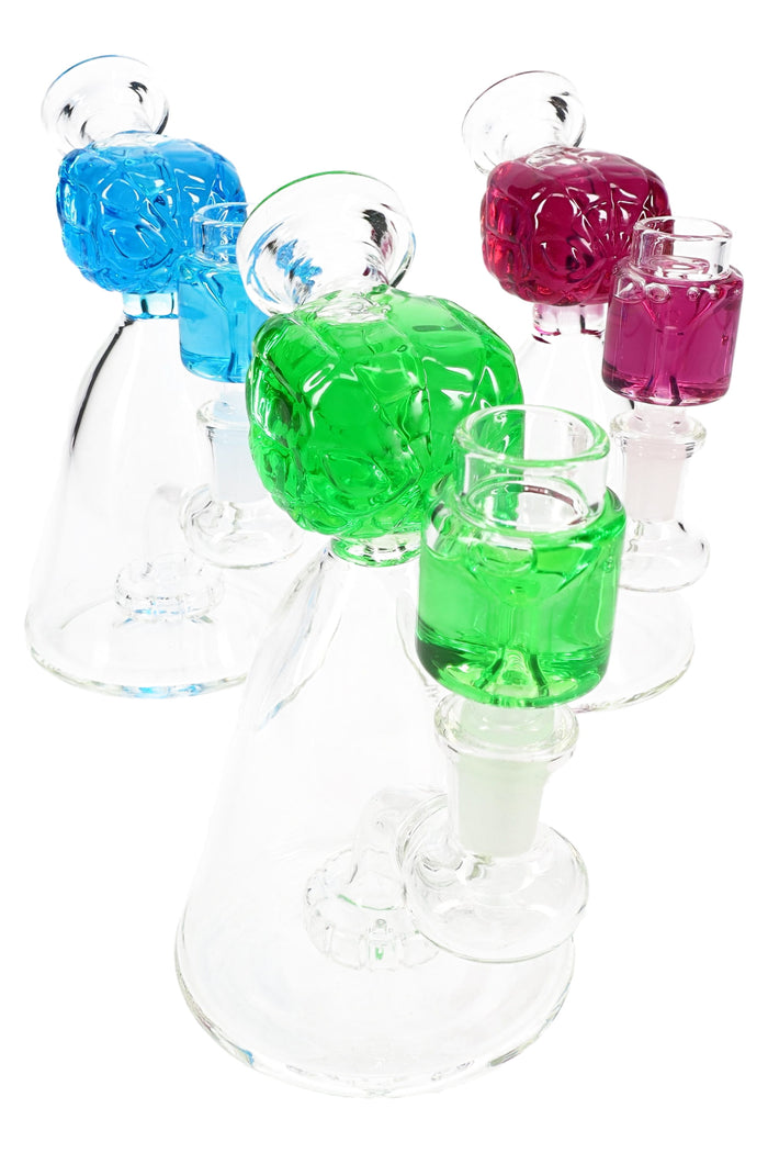 Small glass beaker bong with fluid-filled spider hero head and showerhead perc in assorted vibrant colors, 6 inches tall.