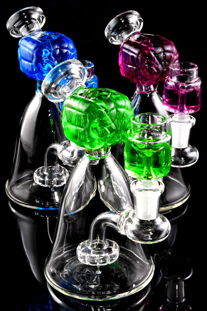 Trio of mini glass beaker bongs on black background showing fluid-filled spider hero tops and showerhead percs.