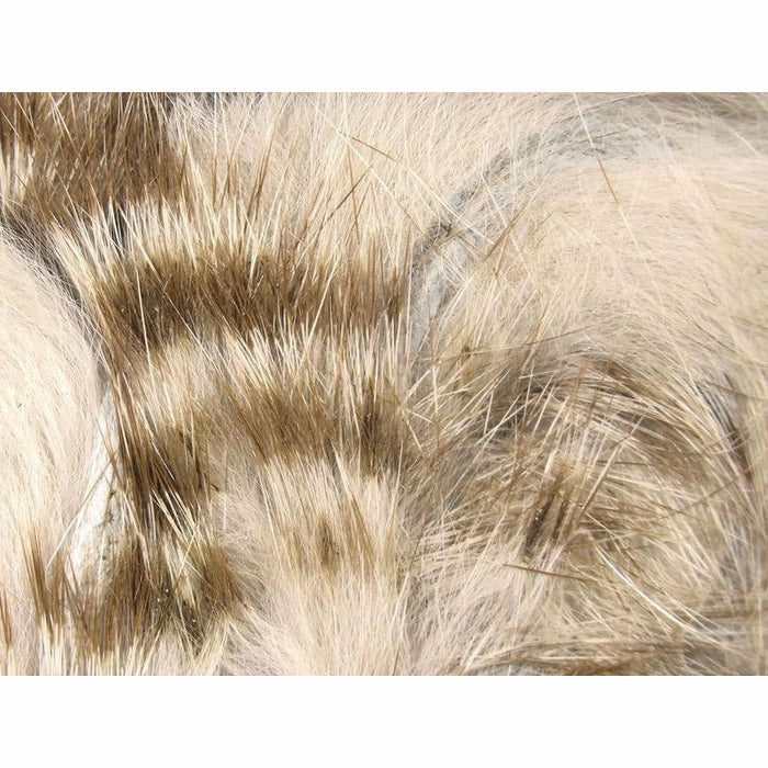 Natural white and beige rabbit strip fly tying material with subtle grey-brown horizontal bars