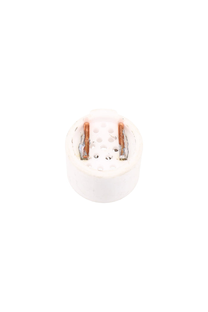 Backside of Solopipe Elektra ceramic bowl showing perforated base and two copper contact tabs on a compact white insert.