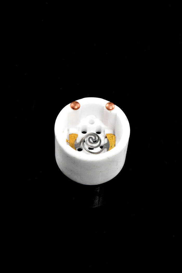 Solopipe Elektra replacement ceramic bowl on black background, white ceramic cup with visible spiral heating coil and contacts.